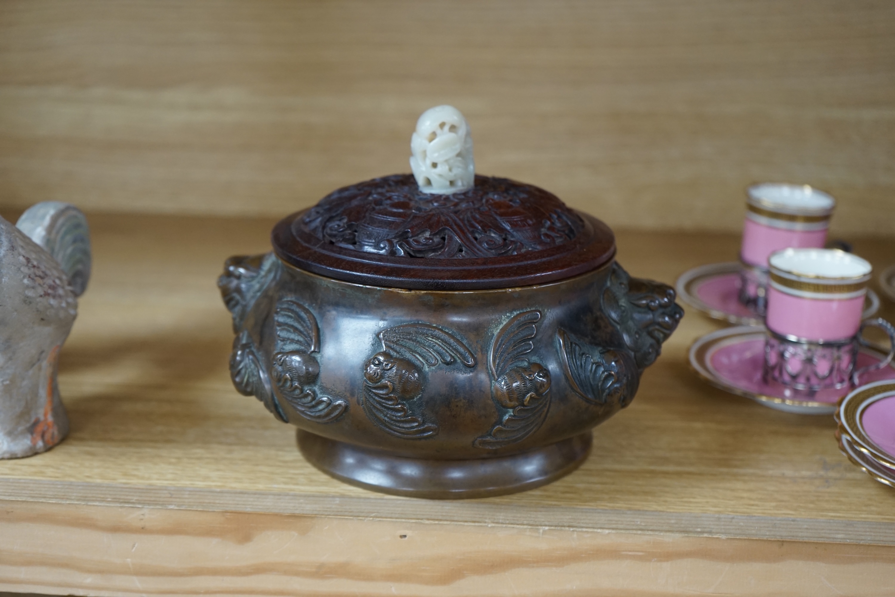 A Chinese bronze censer, with carved wooden cover and jade finial, 17cm high. Condition - good